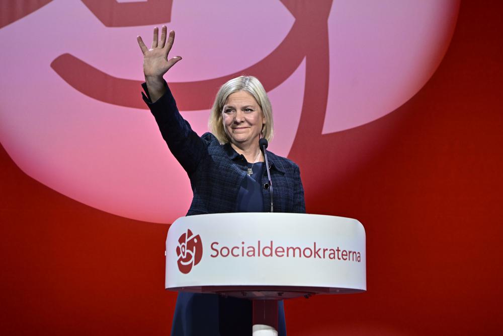 Poll workers count votes at a polling station at Hästhagens Sport Center in Malmö, Sweden, Sunday, Sept. 11, 2022. An exit poll projected that Sweden’s ruling left-wing Social Democrats have won the most votes in a general election Sunday, while a right-wing populist party had its best showing yet. (Johan Nilsson/TT News Agency via AP)